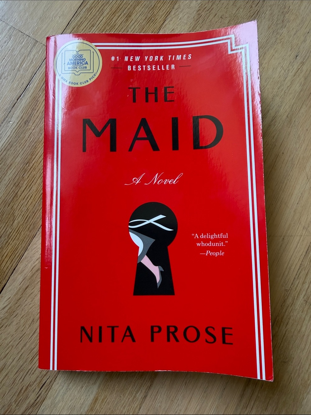 NWT - never read The Maid by Nita Prose - Red Paperback Novel